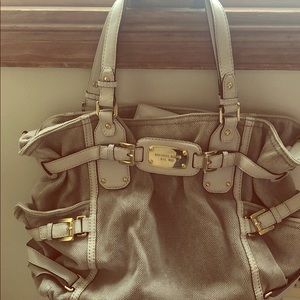 Michael Kors tote with leather straps and buckled